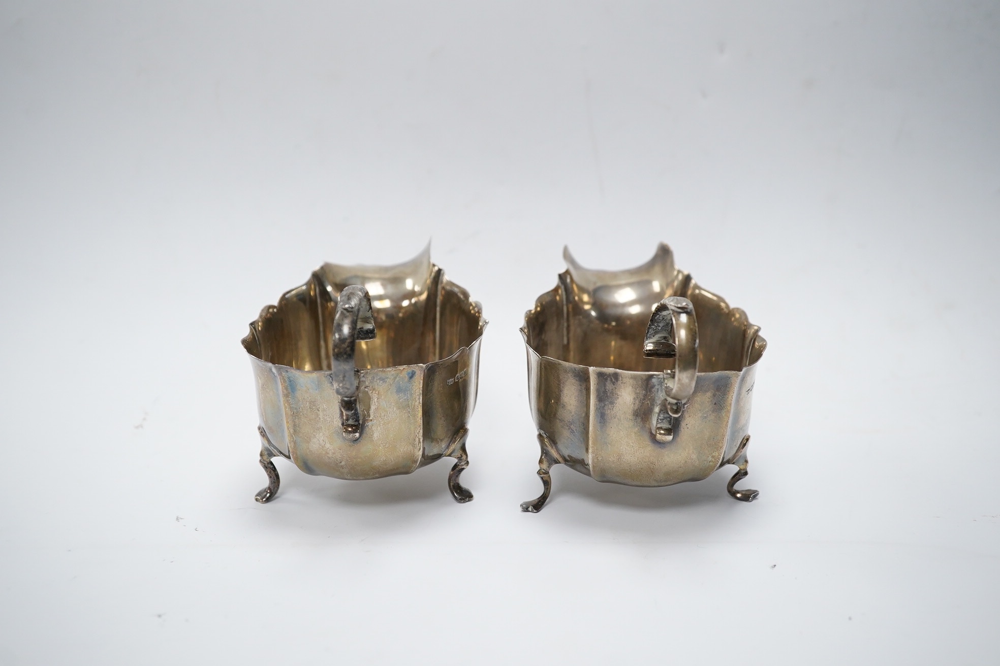 A pair of George V silver sauceboats, by Mappin & Webb, Sheffield, 1923, length 13cm, 6.2oz. Condition - fair